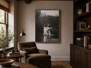 An office with art depicting Jesus and John the Baptist embracing in the water