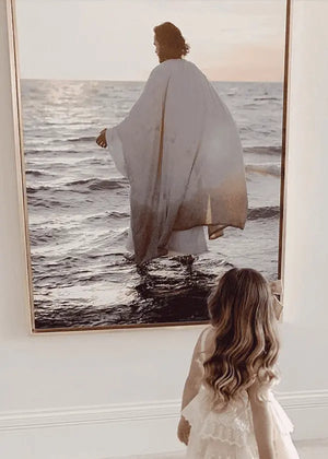 A young girl looks at an image of Jesus Walking on Water 