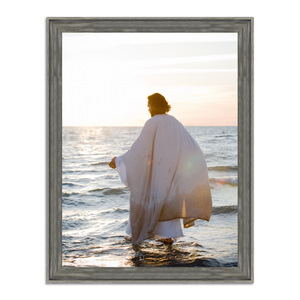 Jesus walking on water at sunset, viewed from behind, white robe with deliberate splashes around his feet. Original photograph by Mark Mabry.